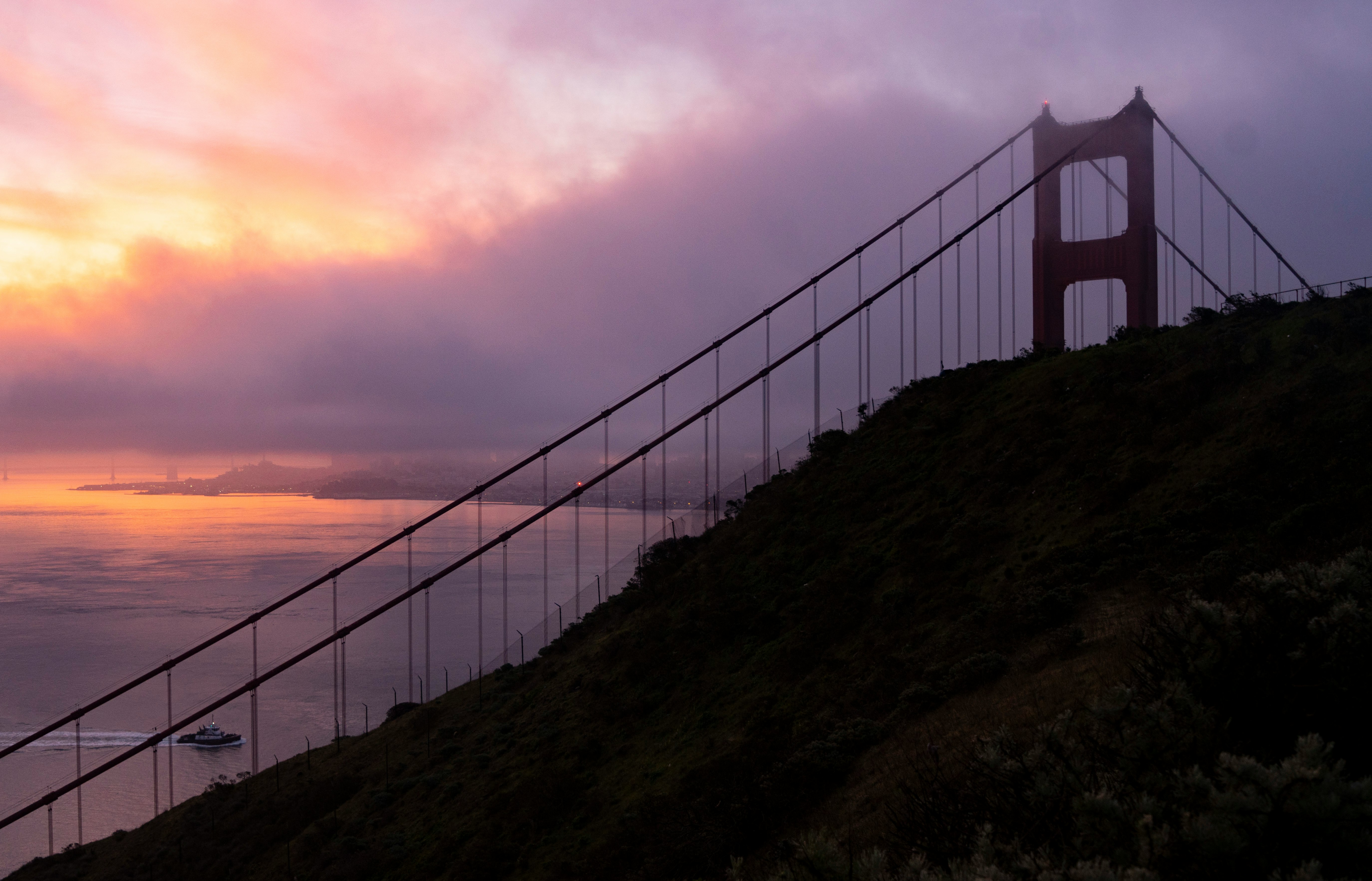 white bridge over the sea during sunset